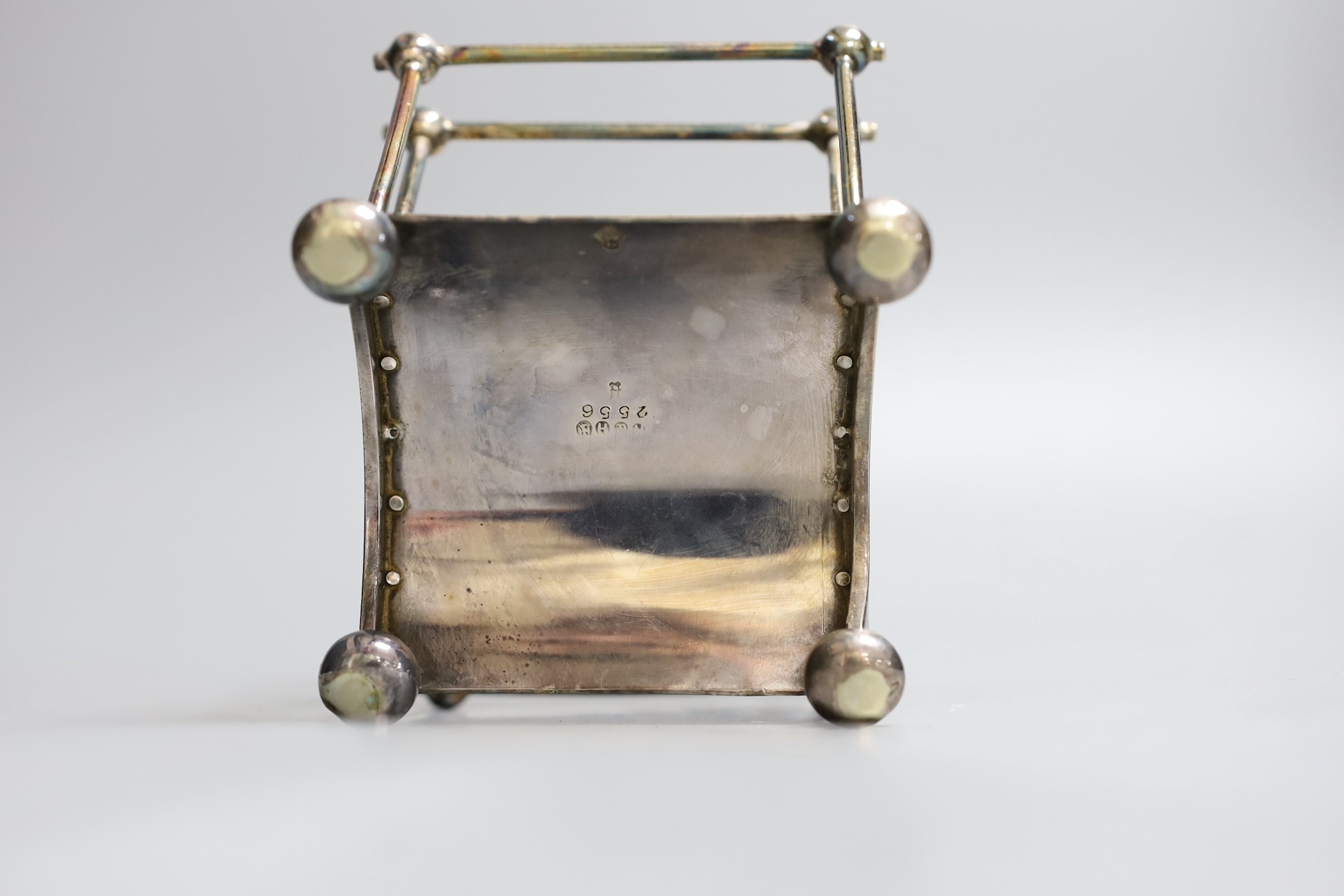A Victorian Cristopher Dresser for Hukin & Heath silver plated seven bar toastrack, of fan shape, on bun feet, numbered 2556, width 13.5cm.